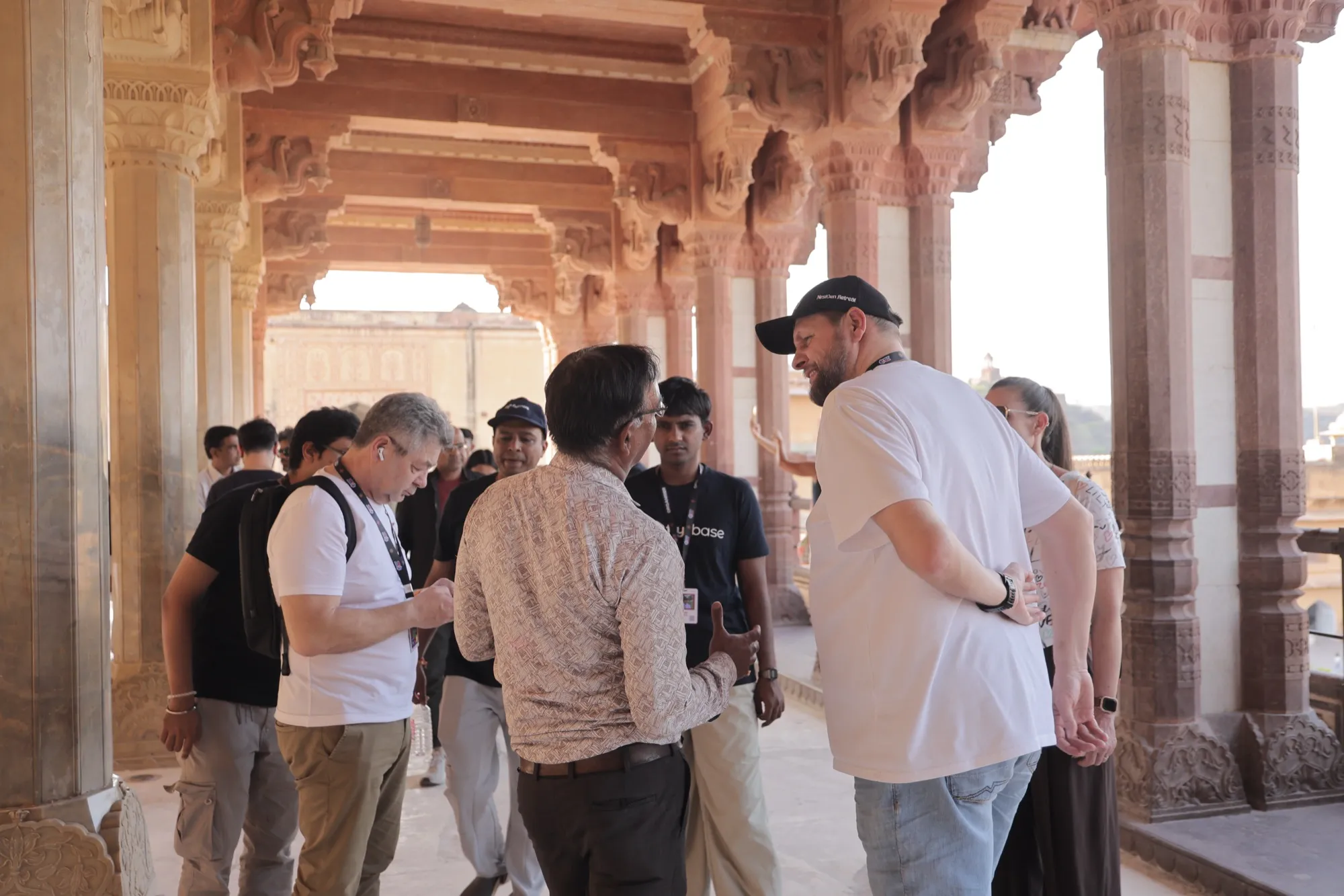 Guests among the red sandstone pillars of Amer Fort