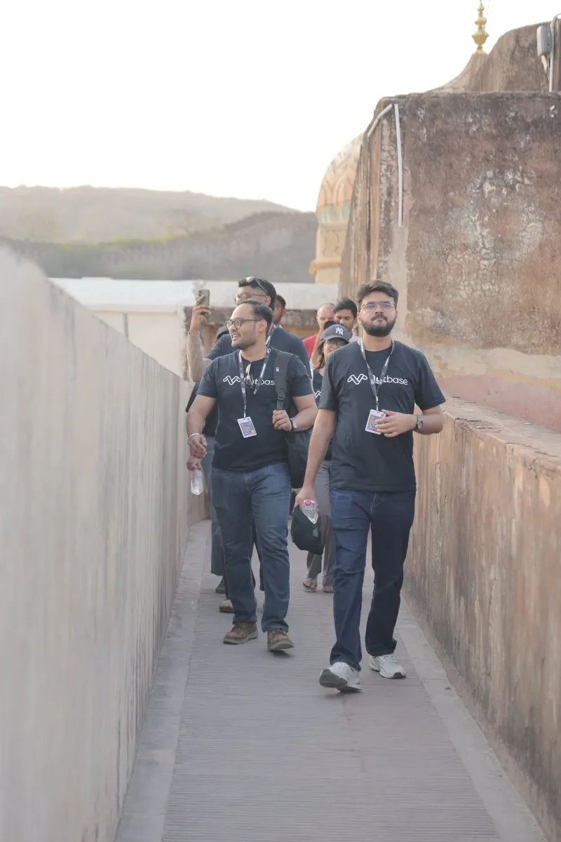 Guests walking single file along the walls of Amer Fort