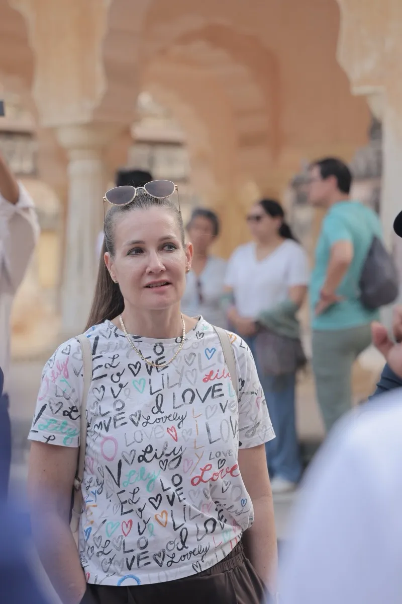 A guest in the crowd in the courtyard of Amer Fort