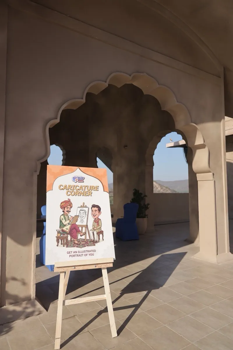 A caricature poster on an easel under a scalloped arch
