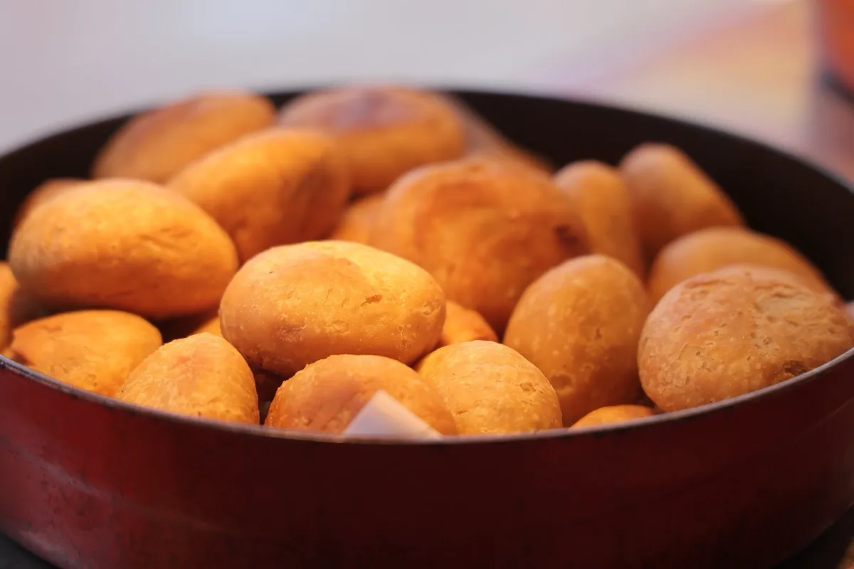A copper bowl of golden kachoris