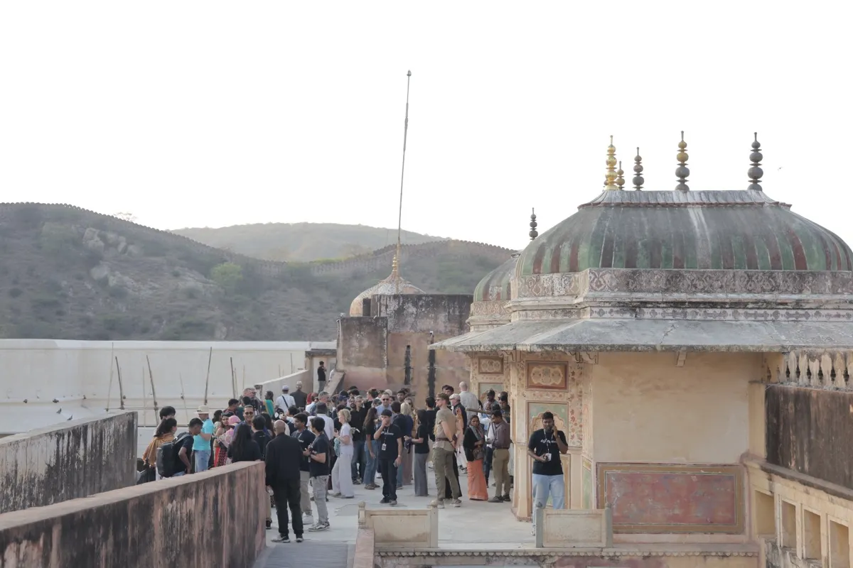 Guests gathered on a terrace of the fort by a domed pavilion