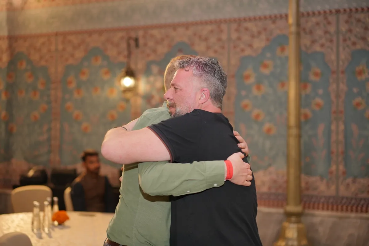 Two pioneers in a long goodbye hug
