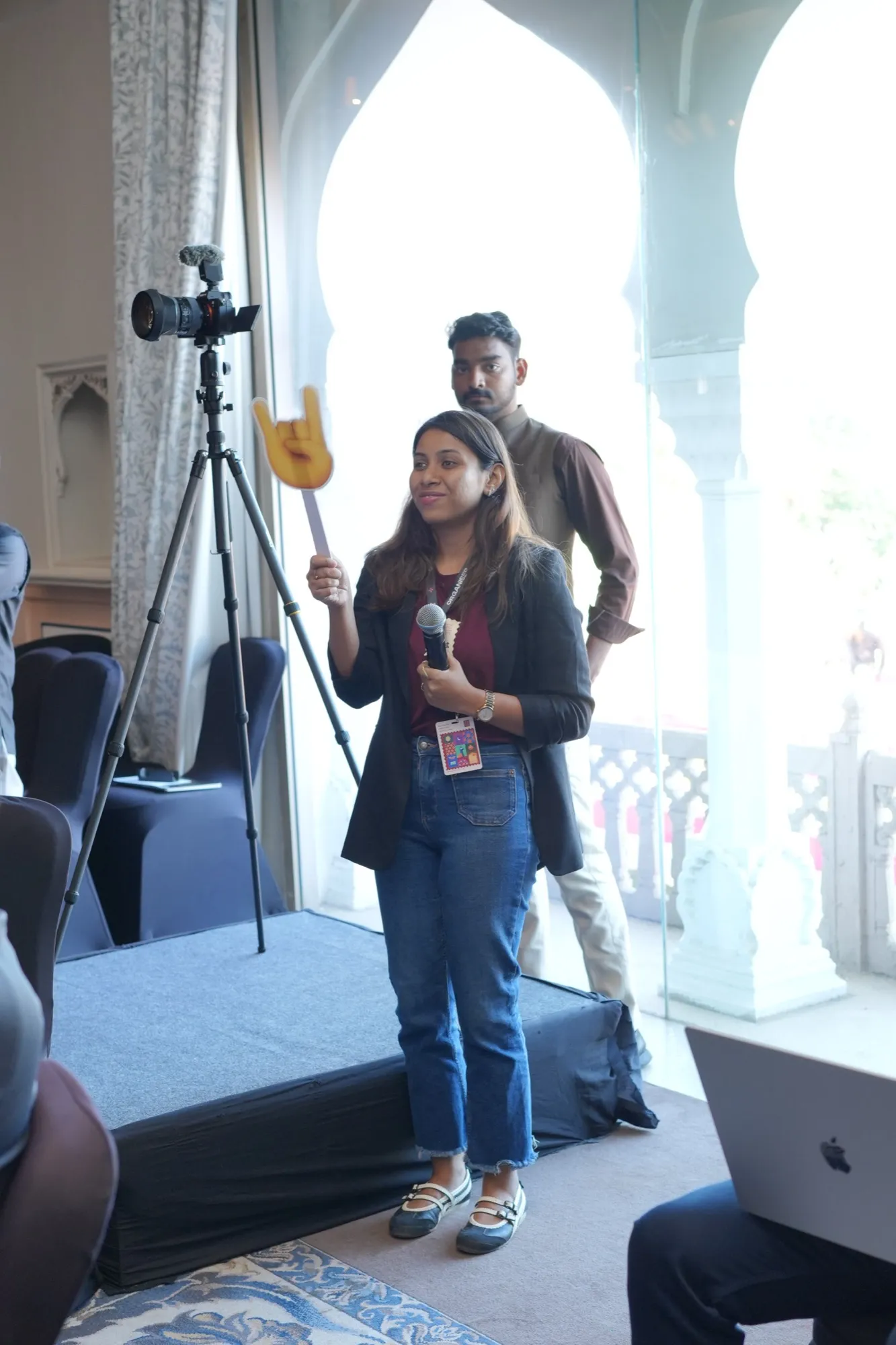 A FlytBase host with a microphone beside the camera in the Forum room